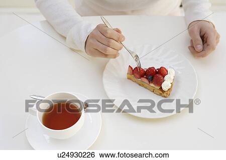 Stock Photograph - View of beverage and pastry served on a table. Fotosearch