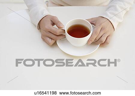 View of beverage in a teacup View Large Photo Image Stock Photo - View of beverage in a teacup. Fotosearch