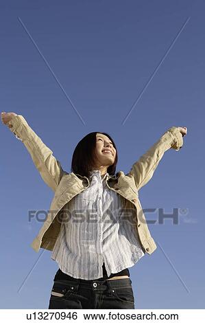 View of a happy young woman View Large Photo Image Stock Photograph - View of a happy young woman. Fotosearch