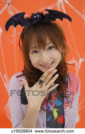 Picture - Close-up of teenage girl wearing a headdress. Fotosearch