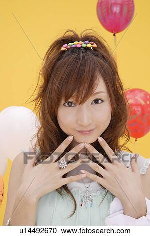 Portrait of a teenage girl with hand on chin View Large Photo Image Stock Image - Portrait of a teenage girl with hand on chin. Fotosearch