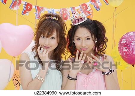 Stock Image - Portrait of teenage girls wearing nightdress. Fotosearch