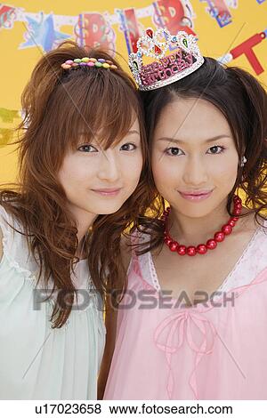 Stock Photo - Portrait of teenage girls wearing nightdress. Fotosearch