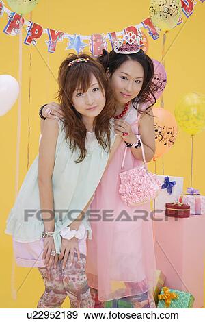 Stock Photo - Portrait of teenage girls wearing nightdress. Fotosearch