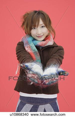 Close-up of a teenager girl wearing hand gloves and muffler View Large Photo Image Stock Image - Close-up of a teenager girl wearing hand gloves and muffler. Fotosearch