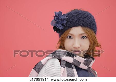 Portrait of a teenage girl wearing a muffler View Large Photo Image Picture - Portrait of a teenage girl wearing a muffler. Fotosearch