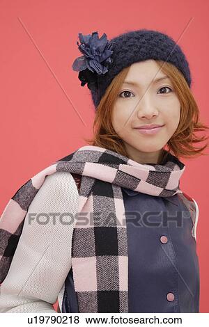 Stock Photo - Portrait of a teenage girl wearing a muffler. Fotosearch