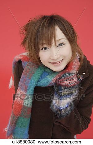 Portrait of a teenager girl wearing a muffler View Large Photo Image Stock Image - Portrait of a teenager girl wearing a muffler. Fotosearch