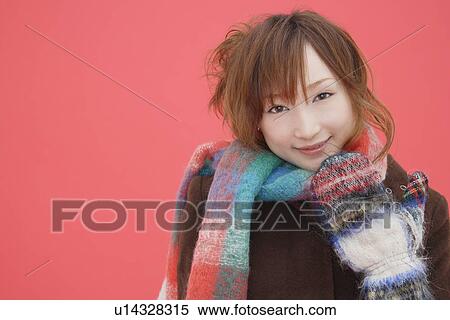 Portrait of a teenager girl wearing a muffler View Large Photo Image Stock Photography - Portrait of a teenager girl wearing a muffler. Fotosearch