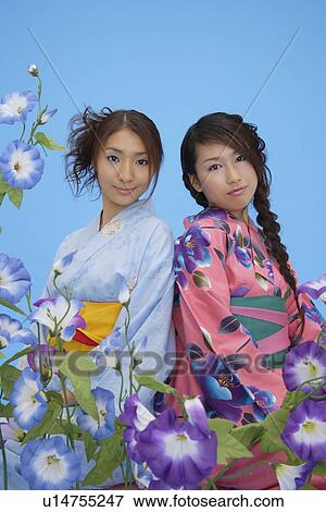 Stock Photo - Portrait of teenage girls in traditional outfits. Fotosearch