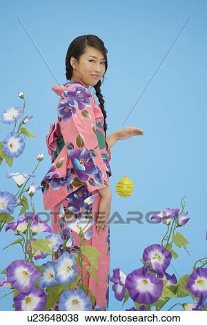 Stock Photo - View of a teenage girl in traditional outfit. Fotosearch