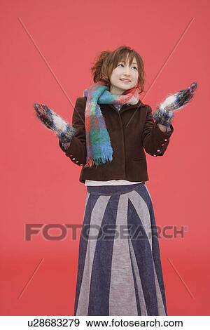 Stock Photo - View of a teenage girl in winter clothing. Fotosearch
