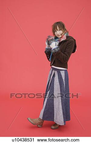 View of a teenager girl in winter clothing View Large Photo Image Stock Image - View of a teenager girl in winter clothing. Fotosearch