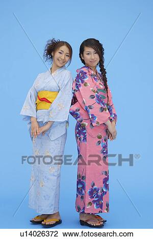 Stock Image - View of teenage girls in traditional outfits. Fotosearch