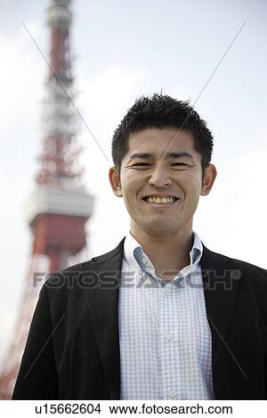 Close-up of a smiling young man View Large Photo Image Picture - Close-up of a smiling young man. Fotosearch