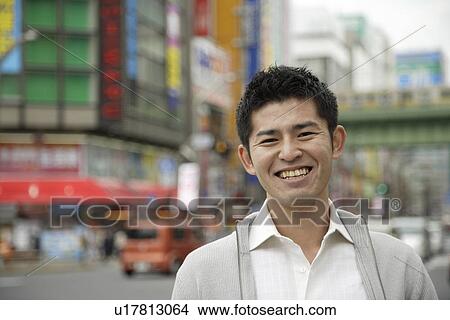 Picture - Close-up of a smiling young man. Fotosearch