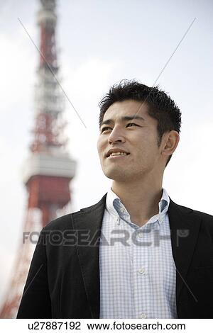Stock Image - Close-up of a young man looking away. Fotosearch
