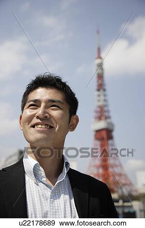 Close-up of a young man looking up View Large Photo Image Stock Photo - Close-up of a young man looking up. Fotosearch