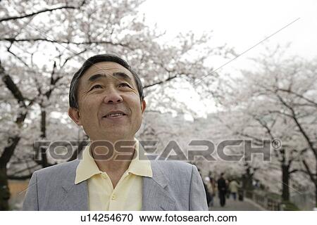 Stock Image - Close-up of a senior man looking up. Fotosearch