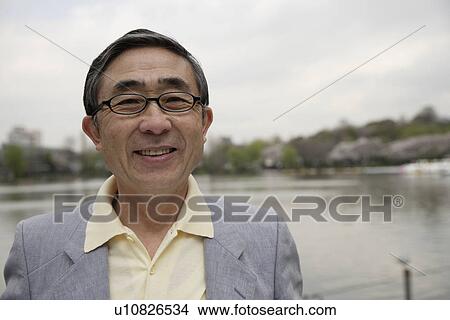 Close-up of a senior man wearing spectacles View Large Photo Image Picture - Close-up of a senior man wearing spectacles. Fotosearch