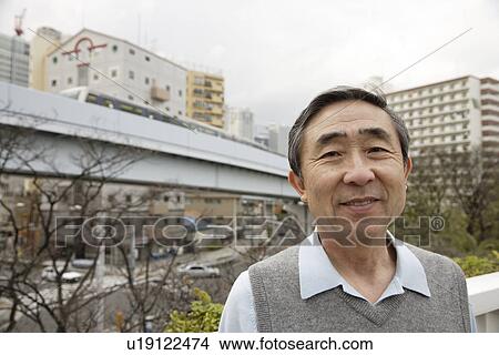 Picture - Portrait of a businessman smiling. Fotosearch