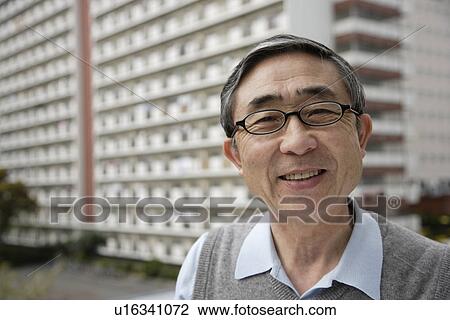 Stock Image - Portrait of a businessman smiling. Fotosearch