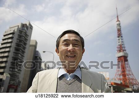 Stock Image - Portrait of a businessman smiling. Fotosearch