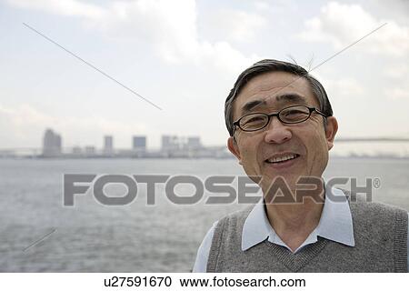 Stock Image - Portrait of a businessman smiling. Fotosearch