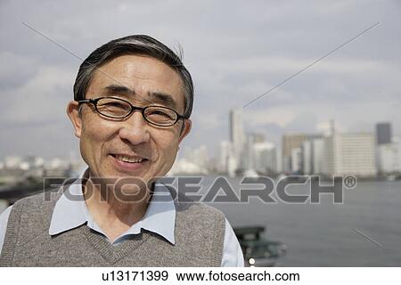 Stock Photo - Portrait of a businessman smiling. Fotosearch