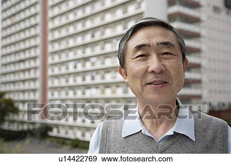Portrait of a businessman smiling View Large Photo Image Stock Photo - Portrait of a businessman smiling. Fotosearch