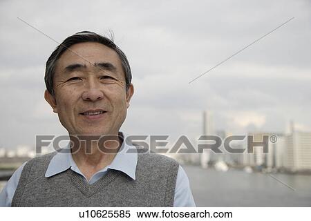 Stock Photography - Portrait of a businessman smiling. Fotosearch
