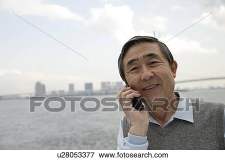 Portrait of a businessman using cellphone View Large Photo Image Stock Photo - Portrait of a businessman using cellphone. Fotosearch