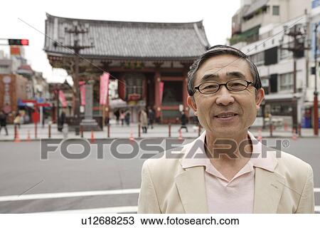 Portrait of a smiling senior man wearing glasses View Large Photo Image Stock Image - Portrait of a smiling senior man wearing glasses. Fotosearch