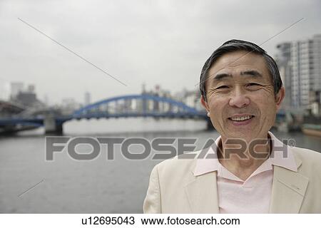 Stock Image - Portrait of a smiling senior man. Fotosearch