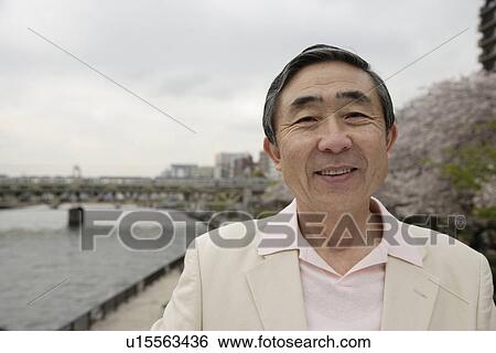 Portrait of a smiling senior man View Large Photo Image Stock Photograph - Portrait of a smiling senior man. Fotosearch
