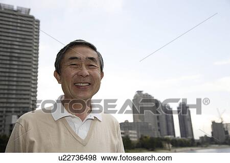 Stock Photo - Portrait of smiling senior man. Fotosearch