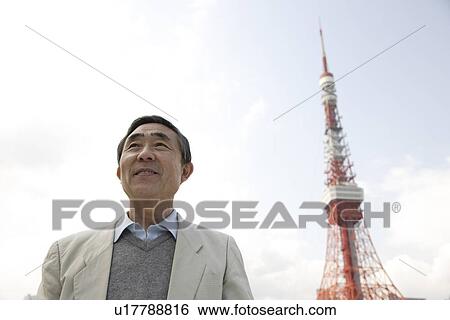 Stock Photograph - View of a businessman smiling. Fotosearch