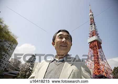 Stock Photography - View of a businessman smiling. Fotosearch