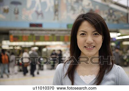 Stock Image - Close-up of a young woman smiling. Fotosearch