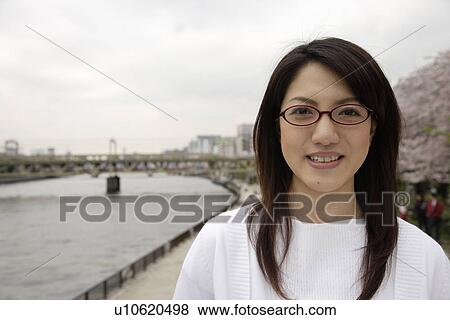 Stock Photo - Close-up of a young woman smiling. Fotosearch