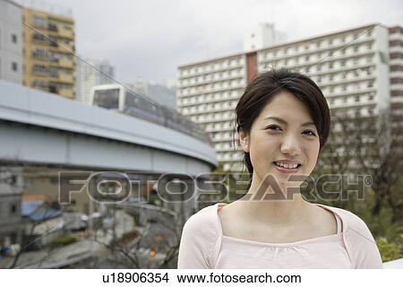 Picture - Portrait of a smiling young woman. Fotosearch