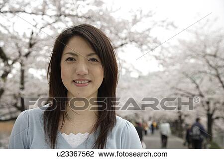 Stock Image - Portrait of a smiling young woman. Fotosearch