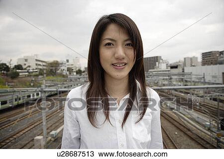 Stock Image - Portrait of a smiling young woman. Fotosearch