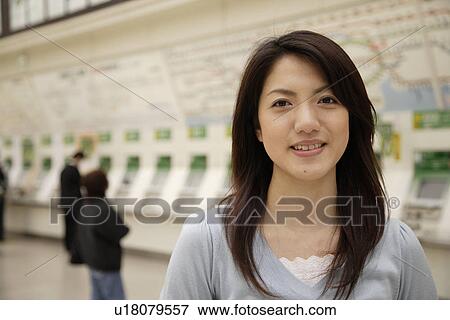 Portrait of a smiling young woman View Large Photo Image Stock Photo - Portrait of a smiling young woman. Fotosearch