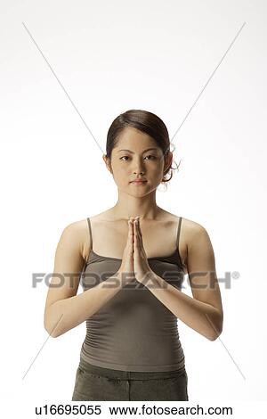 Close-up of a young woman meditating View Large Photo Image Stock Photography - Close-up of a young woman meditating. Fotosearch