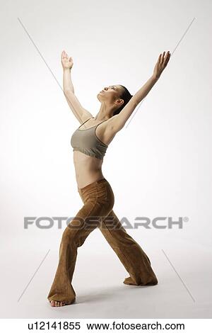 Stock Photography - View of a young woman stretching her body. Fotosearch