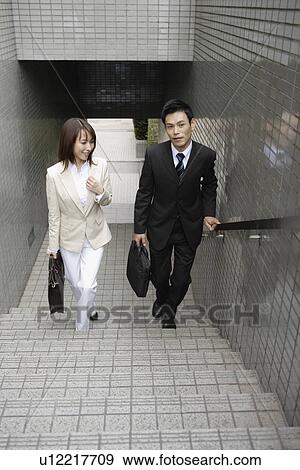 High angle view of two professionals climbing stairs View Large Photo Image Stock Photo - High angle view of two professionals climbing stairs. Fotosearch