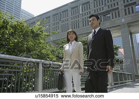 Low angle view of two professionals View Large Photo Image Stock Photography - Low angle view of two professionals. Fotosearch
