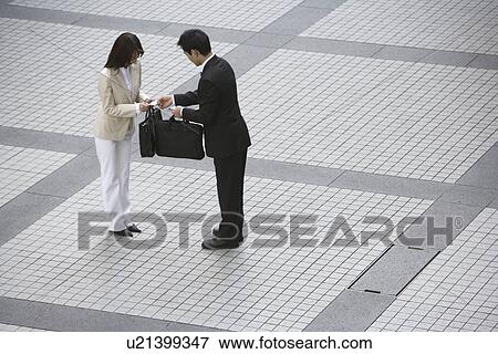 Stock Photo - Side view of two professionals. Fotosearch