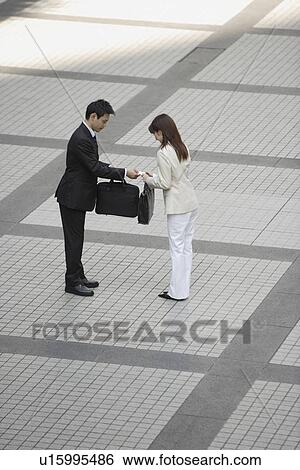 Stock Photograph - View of professionals conversing. Fotosearch